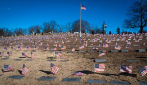Flags fly over the graves of veterans at the North Burial Ground